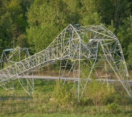 Hydro Ottawa shared this photo on social media showing a toppled Hydro One transmission tower near the Hunt Club Road exit off Highway 417. It's one of four towers Hydro One says were crumpled by storms that hit the area Saturday. (Hydro Ottawa/Twitter)