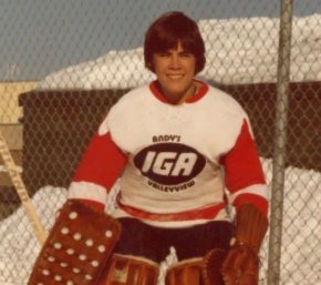 Mark Carney wearing goalie equipment in his youth