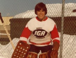 Mark Carney wearing goalie equipment in his youth