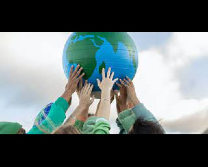 picture of a globe being held up by young people with their hands meeting together
