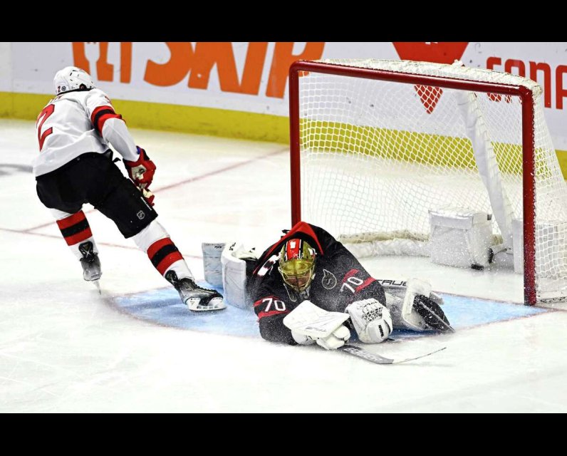 Ottawa Senators goalie Joonas Korpisalo stretches to make a save vs. NJ Devils, Dec. 29, 2023 