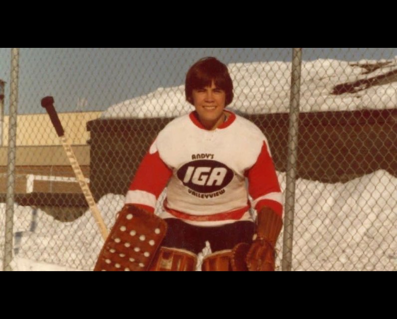 Mark Carney wearing goalie equipment in his youth