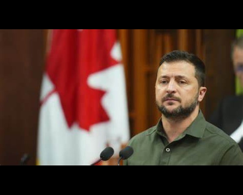 Ukrainian President Volodymyr Zelenskyy in front of a microphone in Canada's Parliament